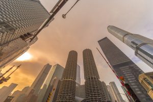 View of several skyscrapers, looking up from the ground.