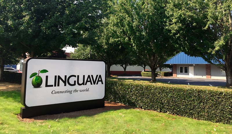 Linguava sign stands on the lawn outside the new building.