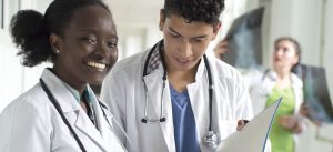 doctors looking at documents and xrays