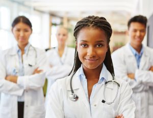 female black doctor in front of team