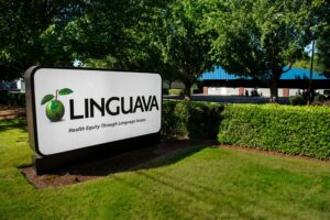 linguava sign outside with logo and text health equity through language access