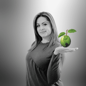black and white headshot of valeria mcnulty linguava interpreter academy trainer and certified medical interpreter holding a green guava globe
