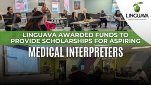 text of linguava awarded funds to provide scholarships for aspiring medical interpreters over background of a class of interpreters training and a linguava logo in top right corner